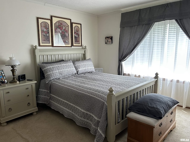 bedroom featuring light carpet and ornamental molding