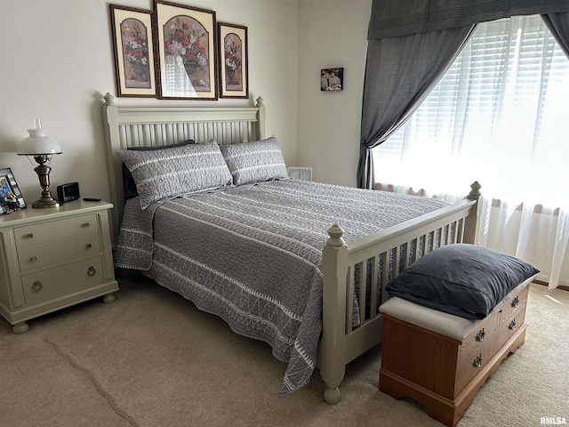 bedroom with light carpet
