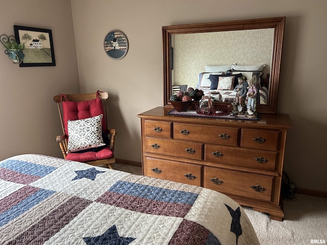 bedroom with baseboards and carpet flooring