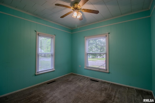 unfurnished room featuring crown molding, carpet floors, and ceiling fan