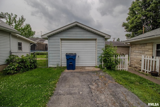 detached garage featuring driveway