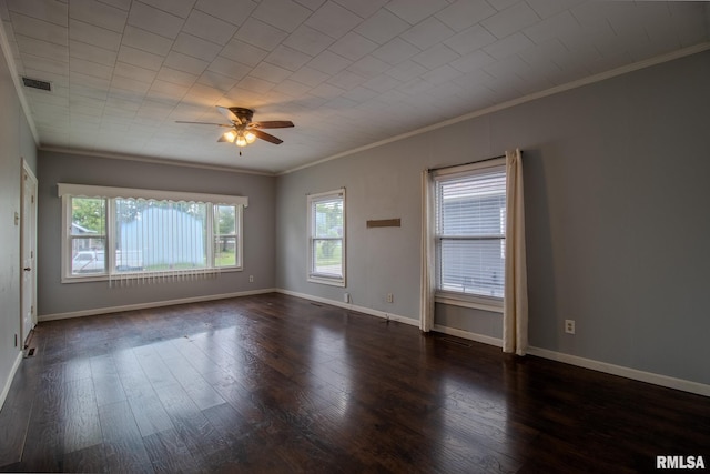 unfurnished room featuring crown molding, healthy amount of natural light, a ceiling fan, wood finished floors, and baseboards