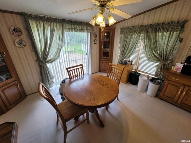 3614 S Hotze Rd, Salem, IL 62881 - dining room featuring light floors, a ceiling fan, and wallpapered walls