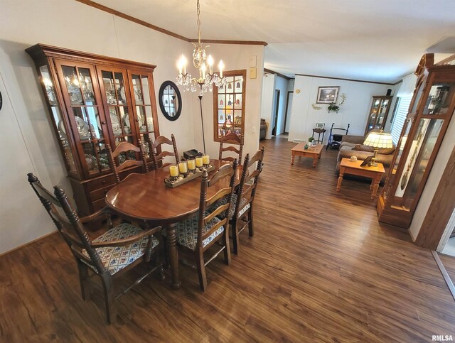 3614 S Hotze Rd, Salem, IL 62881 - dining area featuring ornamental molding, a chandelier, and dark wood-style flooring