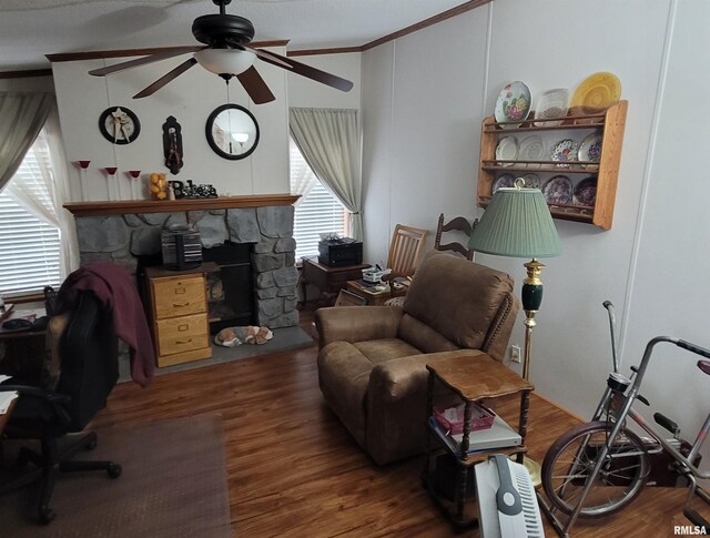 3614 S Hotze Rd, Salem, IL 62881 - living area with a ceiling fan, ornamental molding, wood finished floors, and a fireplace