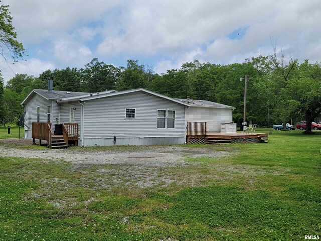 3614 S Hotze Rd, Salem, IL 62881 - back of house featuring a deck and a lawn