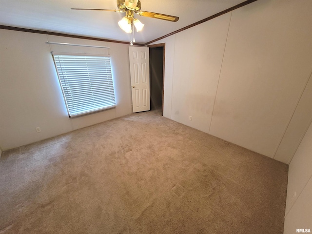 3614 S Hotze Rd, Salem, IL 62881 - empty room featuring carpet floors, crown molding, and ceiling fan