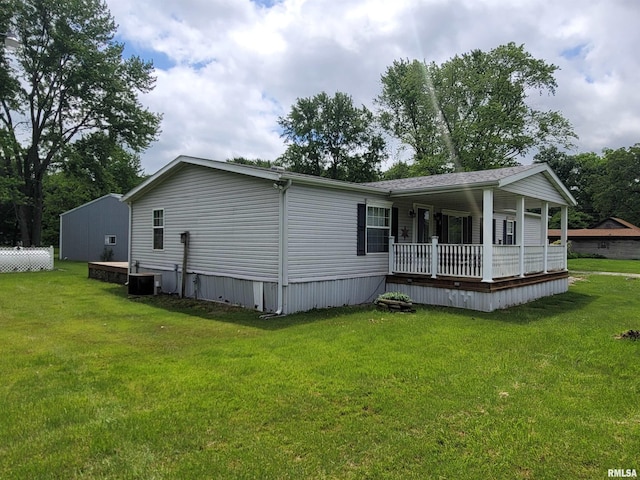 3614 S Hotze Rd, Salem, IL 62881 - rear view of house with a porch, a lawn, and central AC unit