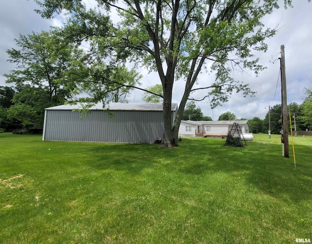 3614 S Hotze Rd, Salem, IL 62881 - view of green lawn featuring a pole building and an outdoor structure