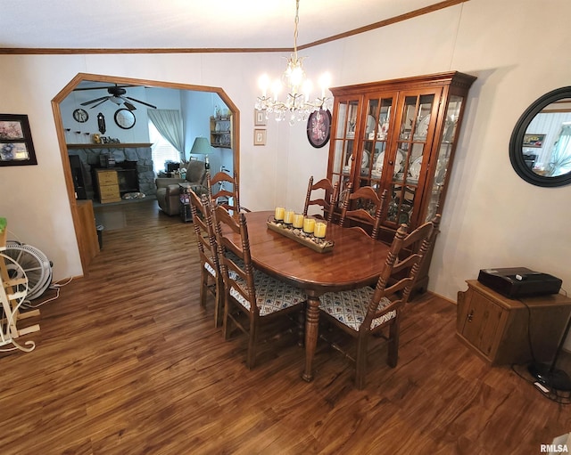 3614 S Hotze Rd, Salem, IL 62881 - dining room with wood finished floors, a fireplace, a ceiling fan, ornamental molding, and a chandelier