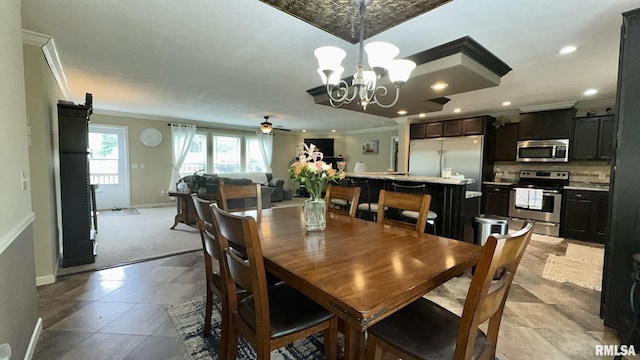 dining space featuring baseboards, ornamental molding, recessed lighting, a ceiling fan, and a chandelier