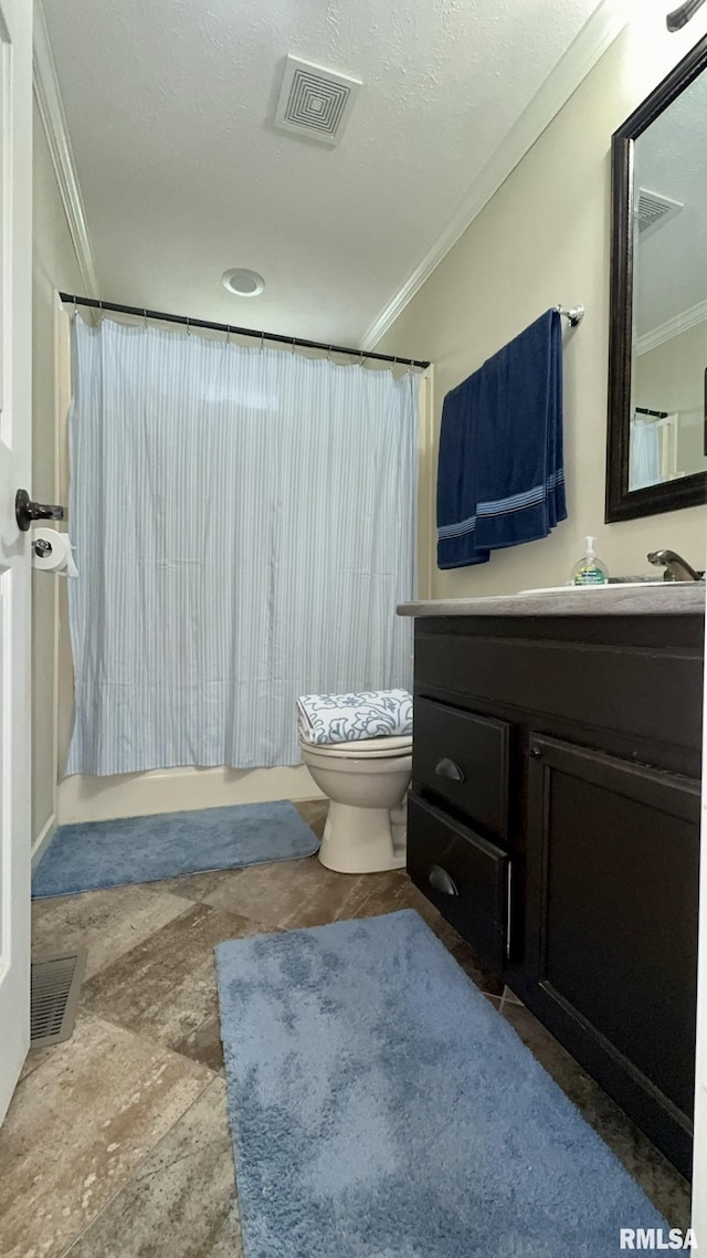 bathroom featuring crown molding, toilet, vanity, a shower with shower curtain, and a textured ceiling
