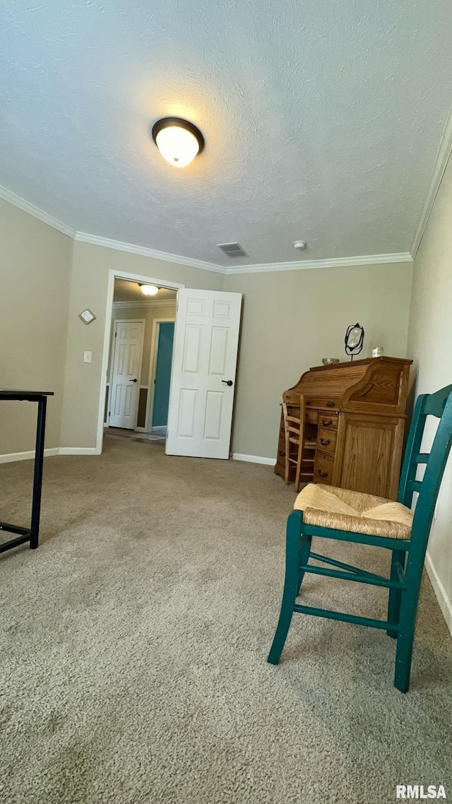 carpeted bedroom featuring baseboards, crown molding, and a textured ceiling