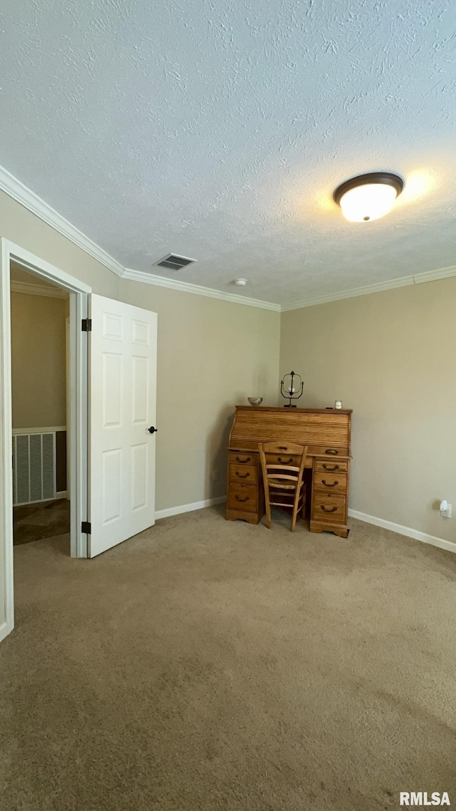 unfurnished office featuring carpet floors, crown molding, a textured ceiling, and baseboards