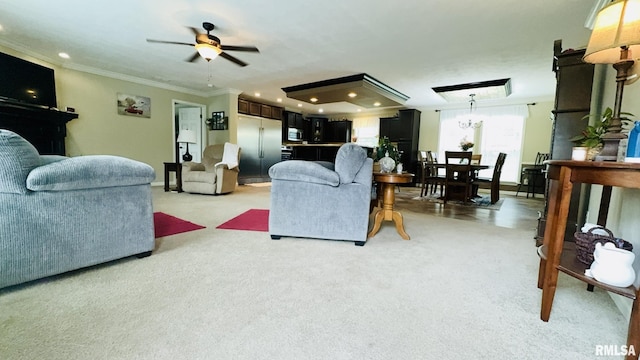 living area with light carpet, ceiling fan, ornamental molding, and recessed lighting