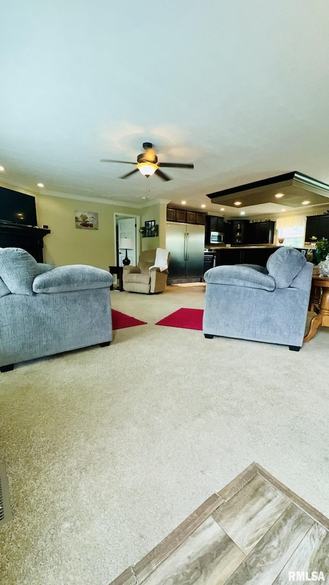 living area with a ceiling fan, carpet flooring, and recessed lighting