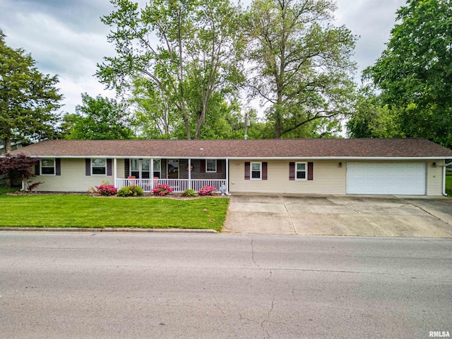 1103 W Boone St, Salem, IL 62881 - ranch-style home with covered porch, driveway, an attached garage, and a front yard