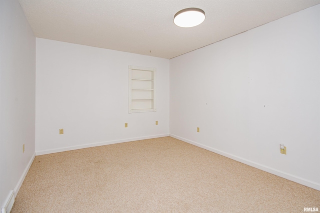 1103 W Boone St, Salem, IL 62881 - carpeted empty room with built in features and baseboards