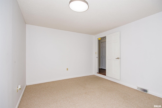 1103 W Boone St, Salem, IL 62881 - carpeted spare room with baseboards and a textured ceiling