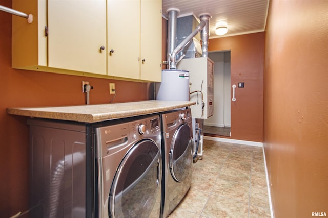 1103 W Boone St, Salem, IL 62881 - washroom with separate washer and dryer, cabinet space, gas water heater, and baseboards