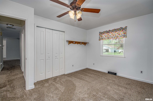 1103 W Boone St, Salem, IL 62881 - unfurnished bedroom with carpet, a closet, baseboards, and ceiling fan