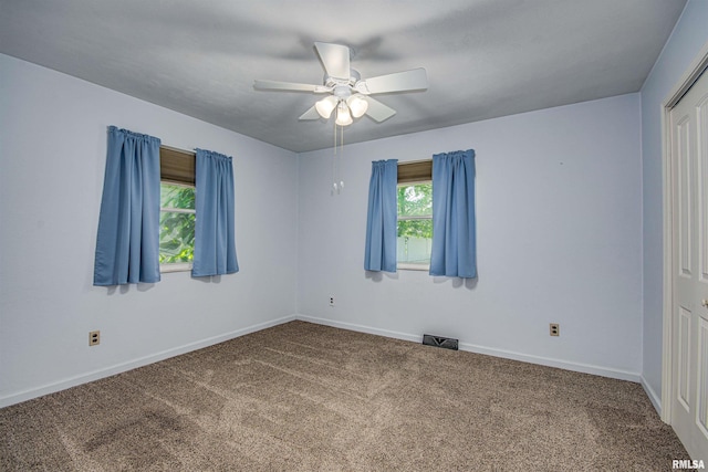 1103 W Boone St, Salem, IL 62881 - carpeted empty room featuring a ceiling fan and baseboards