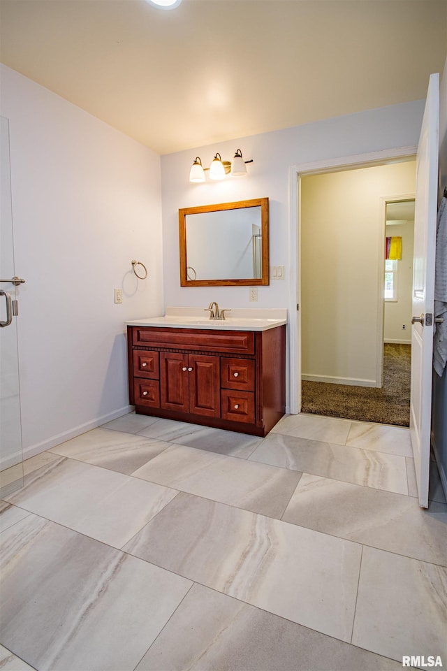 1103 W Boone St, Salem, IL 62881 - bathroom with baseboards, vanity, and tile patterned flooring