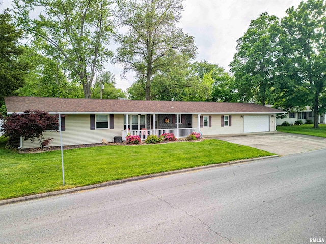 1103 W Boone St, Salem, IL 62881 - ranch-style house with covered porch, a garage, driveway, and a front yard