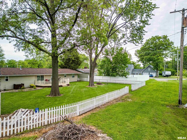1103 W Boone St, Salem, IL 62881 - back of property with an outdoor fire pit and a wooden deck