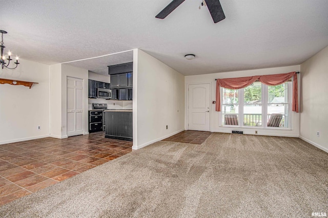 1103 W Boone St, Salem, IL 62881 - unfurnished living room with baseboards, ceiling fan, a chandelier, carpet, and a textured ceiling