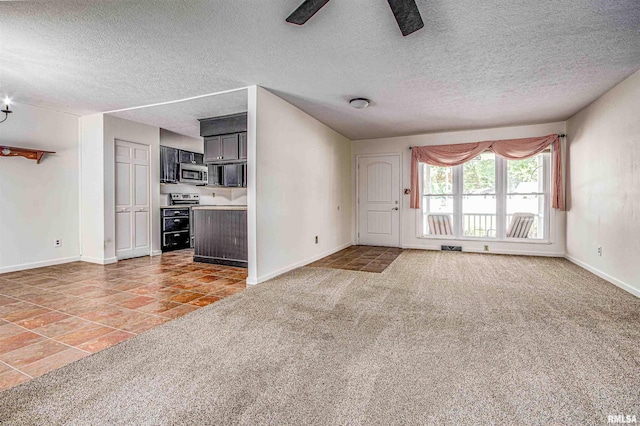 1103 W Boone St, Salem, IL 62881 - unfurnished living room featuring ceiling fan, baseboards, a textured ceiling, light tile patterned floors, and light carpet