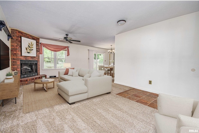 1103 W Boone St, Salem, IL 62881 - carpeted living area with ceiling fan, a brick fireplace, a chandelier, and baseboards