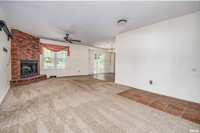 1103 W Boone St, Salem, IL 62881 - unfurnished living room featuring a ceiling fan, a fireplace, a chandelier, baseboards, and carpet flooring