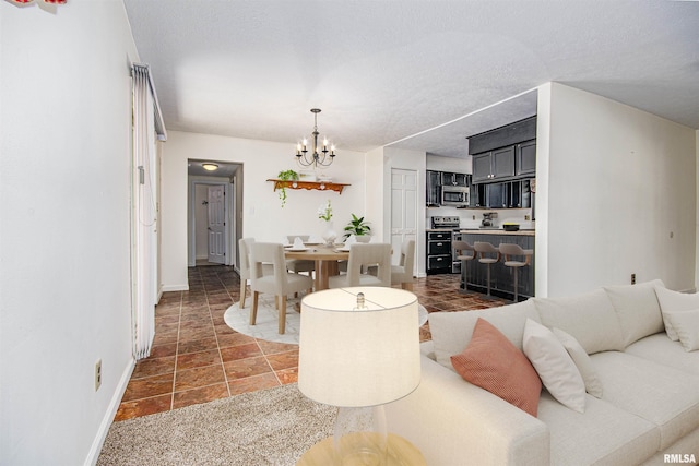 1103 W Boone St, Salem, IL 62881 - living room featuring a chandelier, baseboards, and a textured ceiling