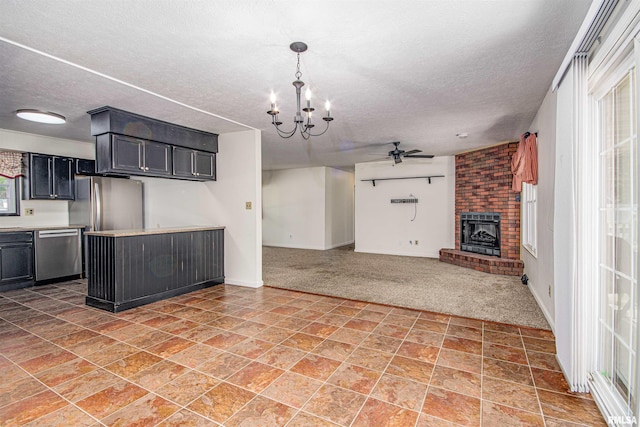 1103 W Boone St, Salem, IL 62881 - kitchen with dishwasher, ceiling fan, a brick fireplace, a textured ceiling, and open floor plan