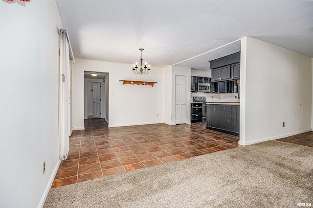 1103 W Boone St, Salem, IL 62881 - kitchen with stainless steel appliances, a chandelier, baseboards, light countertops, and a textured ceiling