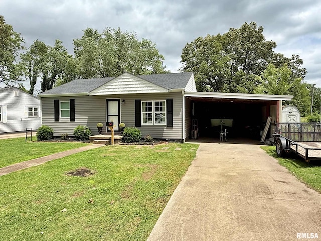 2040 Greenview Ave, Metropolis, IL 62960 - view of front facade featuring driveway, a front yard, an attached carport, and a shingled roof