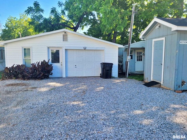 901 Catherine St, Metropolis, IL 62960 - view of side of property featuring an outbuilding, a garage, and driveway