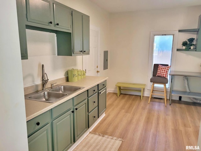 901 Catherine St, Metropolis, IL 62960 - kitchen with green cabinetry, a sink, and light countertops