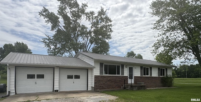 100 N 35th St, Herrin, IL 62948 - ranch-style house featuring a garage, driveway, a front yard, metal roof, and brick siding