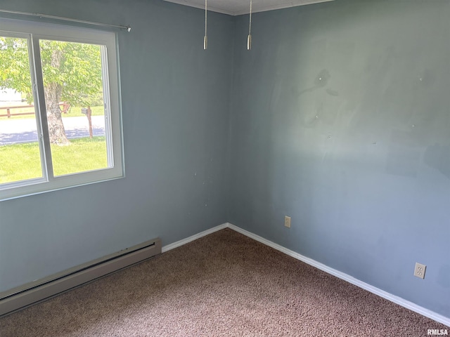 100 N 35th St, Herrin, IL 62948 - empty room featuring a baseboard heating unit, carpet, and baseboards