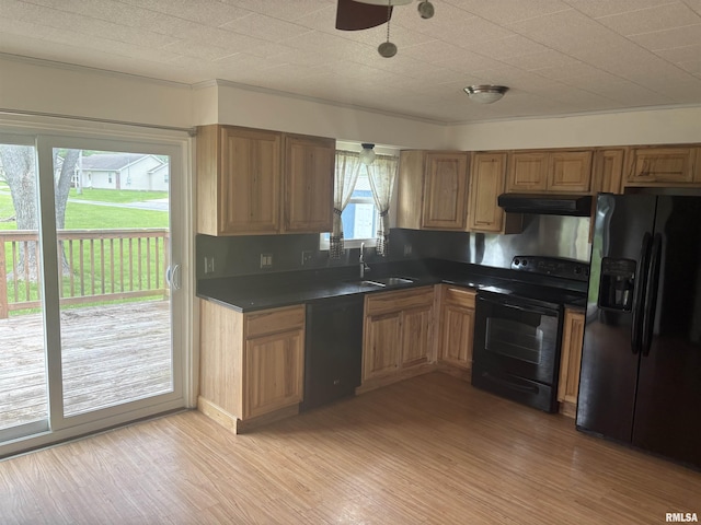 100 N 35th St, Herrin, IL 62948 - kitchen featuring black appliances, under cabinet range hood, a sink, and dark countertops