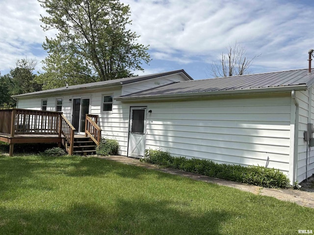 100 N 35th St, Herrin, IL 62948 - rear view of property featuring a deck and a lawn