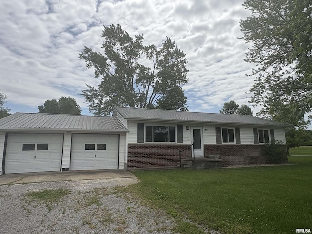 100 N 35th St, Herrin, IL 62948 - ranch-style house with dirt driveway, a front lawn, an attached garage, and brick siding