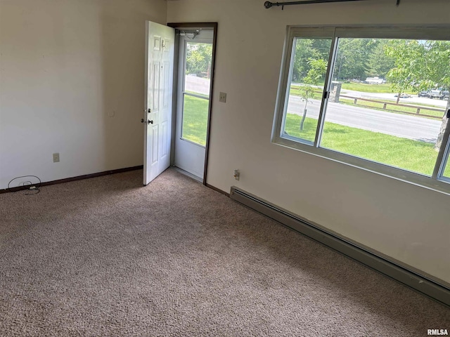 100 N 35th St, Herrin, IL 62948 - unfurnished room featuring a baseboard heating unit, healthy amount of natural light, carpet, and baseboards