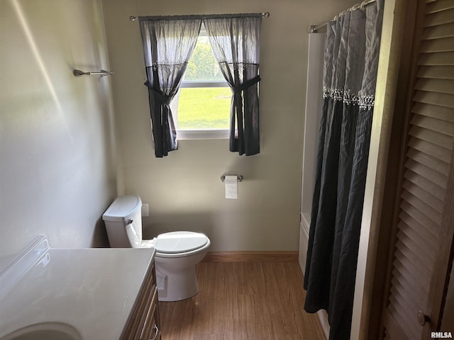 100 N 35th St, Herrin, IL 62948 - bathroom with vanity, toilet, baseboards, and wood finished floors