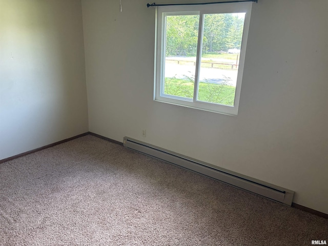 100 N 35th St, Herrin, IL 62948 - spare room with baseboard heating, healthy amount of natural light, carpet flooring, and baseboards