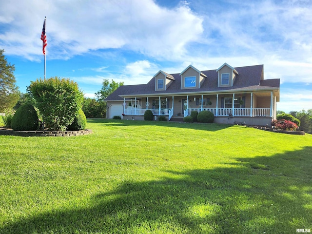 580 Blackman Hill Rd, Harrisburg, IL 62946 - view of front of property featuring a porch, an attached garage, and a front lawn