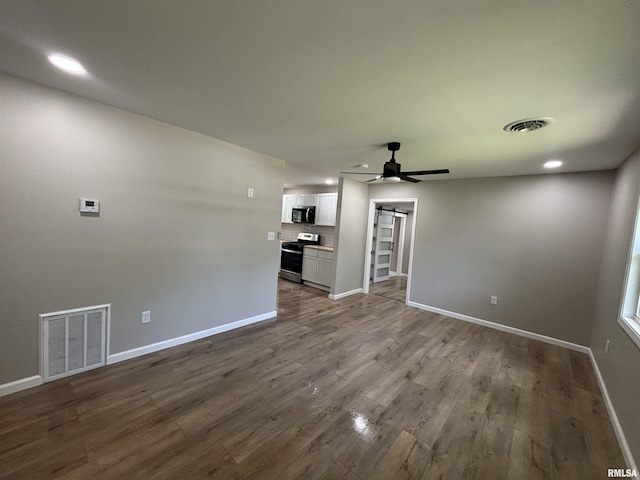 116 Lindsey Ave, Metropolis, IL 62960 - unfurnished living room featuring baseboards, ceiling fan, dark wood-style floors, and recessed lighting