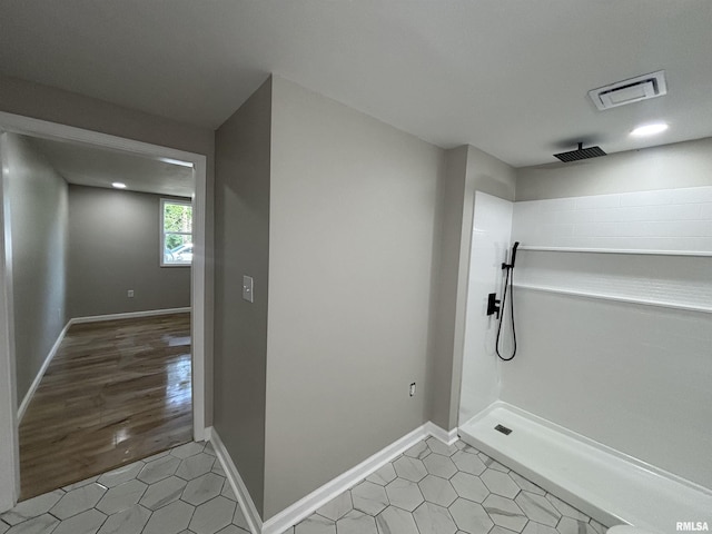 116 Lindsey Ave, Metropolis, IL 62960 - full bath with a tile shower, tile patterned floors, and baseboards